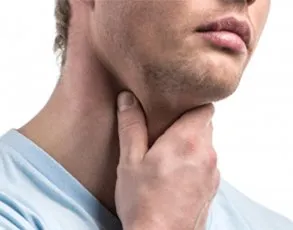 Man holding his neck in discomfort, possibly indicating throat pain or swollen lymph nodes