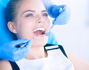 A woman getting her teeth cleaned